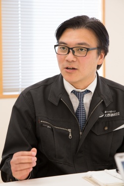 大野建設常務取締役の大野哲矢氏。全国工務店協会(JBN)では中大規模木造委員会副委員長としても活動している(写真:浅田 美浩)