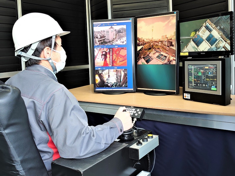 高所の孤独にサヨナラ、鹿島と竹中がタワークレーン遠隔操作を九段会館再開発で初導入