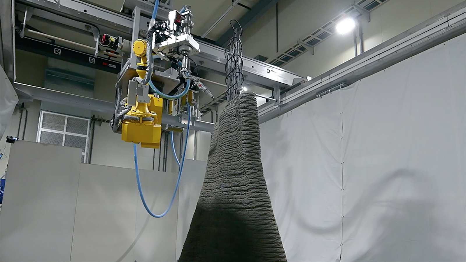 清水建設、3Dプリンターで鉄筋入り曲面壁