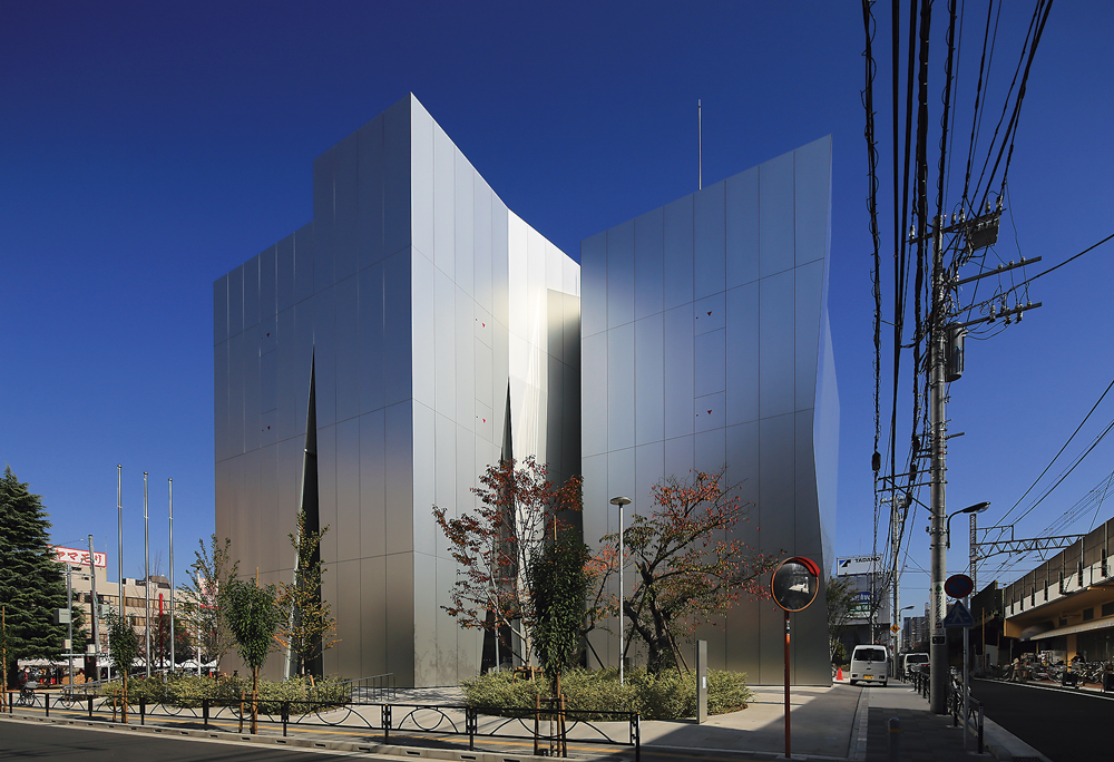 四周にくさび形の開口 分節しつつ人を呼び込む（3ページ目） | 日経